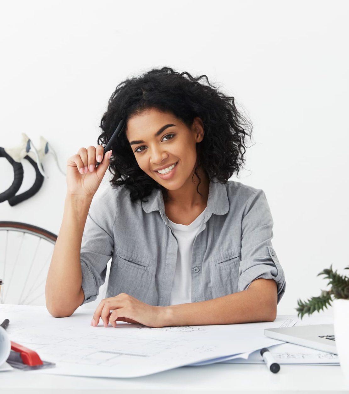 cheerful-professional-young-female-having-dark-ski-E7LXTG9.jpg